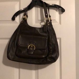Brown coach bag with gold accents